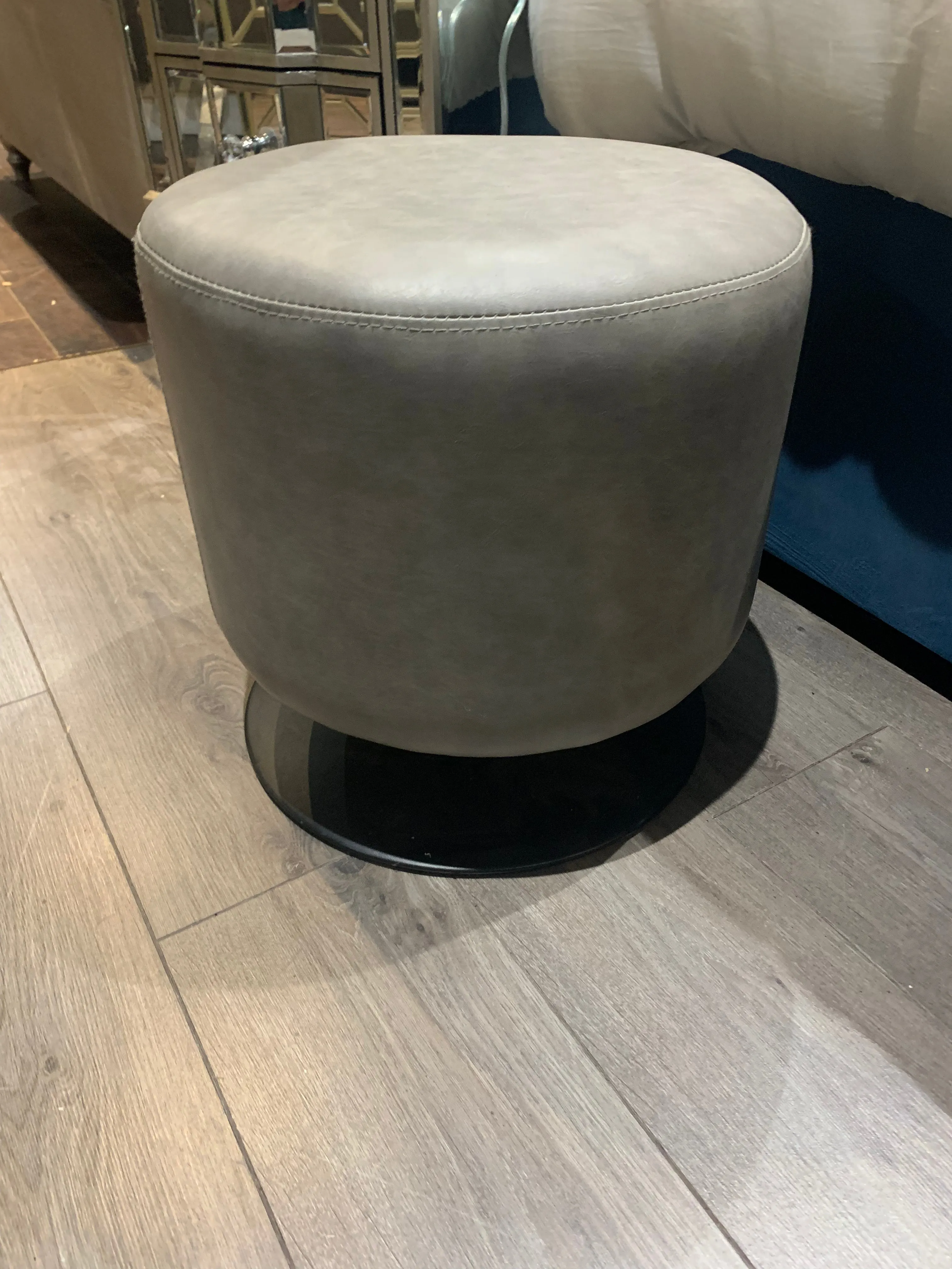 Taupe round small  revolving cylinder  stool reduced for collection